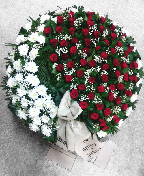 Funeral wreath with red roses and white chrysanthemums