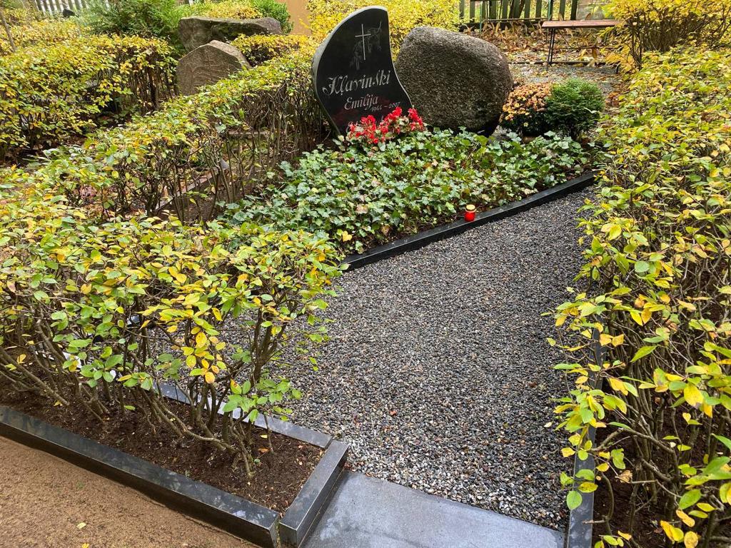 Burial site at Miķelis Cemetery after cleaning, October 2023