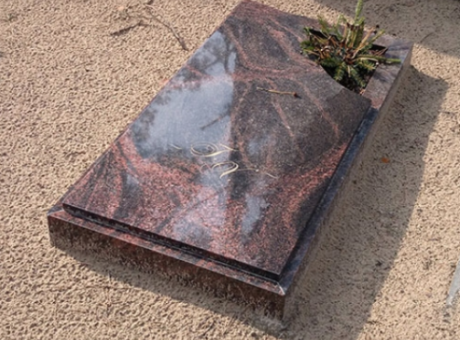 Granite tombstone with corner