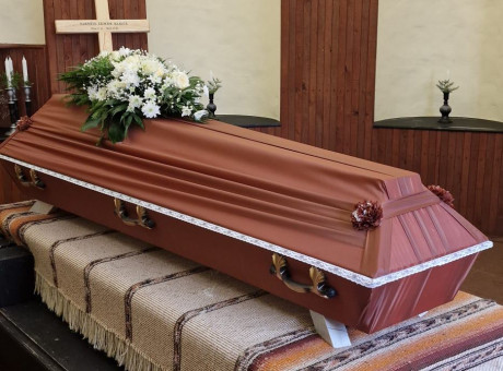 Brown draped coffin