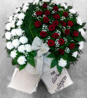 Funeral wreath with red roses and white chrysanthemums