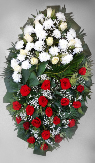 Boat-shaped funeral wreath made of red roses, white chrysanthemums and cream roses