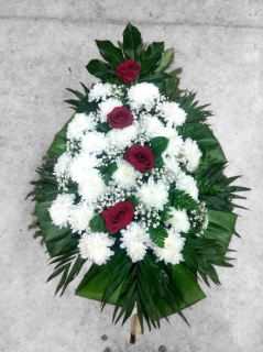 Funeral spray made of red roses and white chrysanthemums