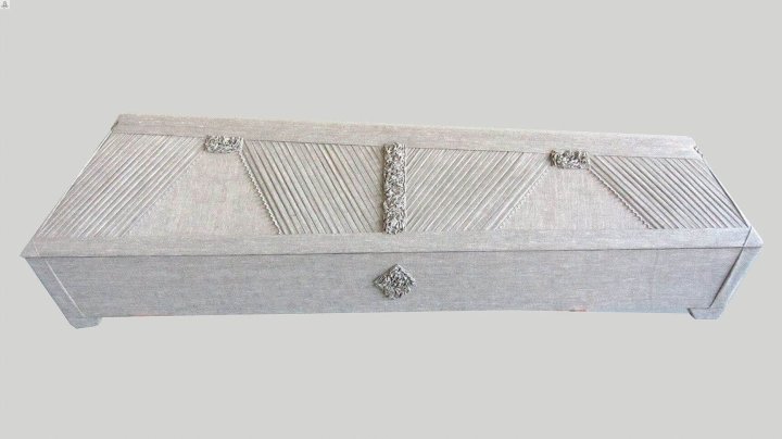 White draped coffin