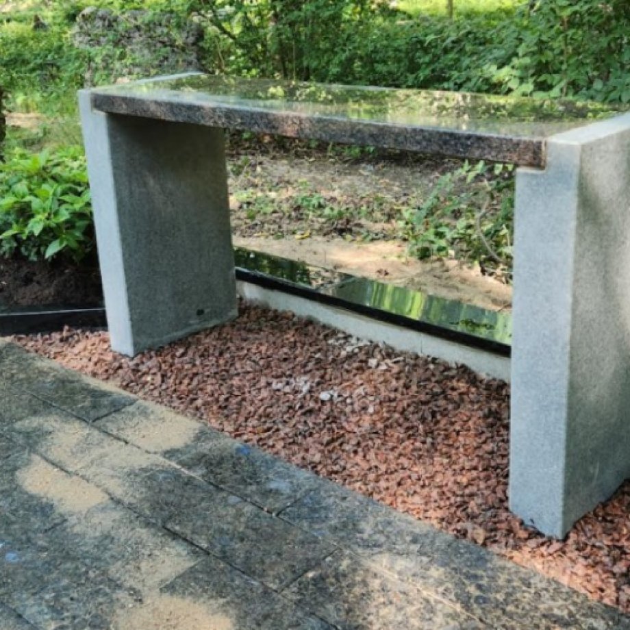 Granite bench with straight legs made of unpolished granite