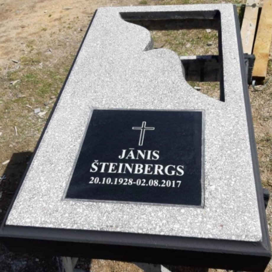 Concrete gravestone with an open corner and a granite plaque for engraving
